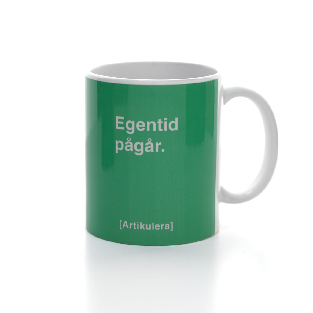 Artikulera-mugg — ”Egentid pågår.”