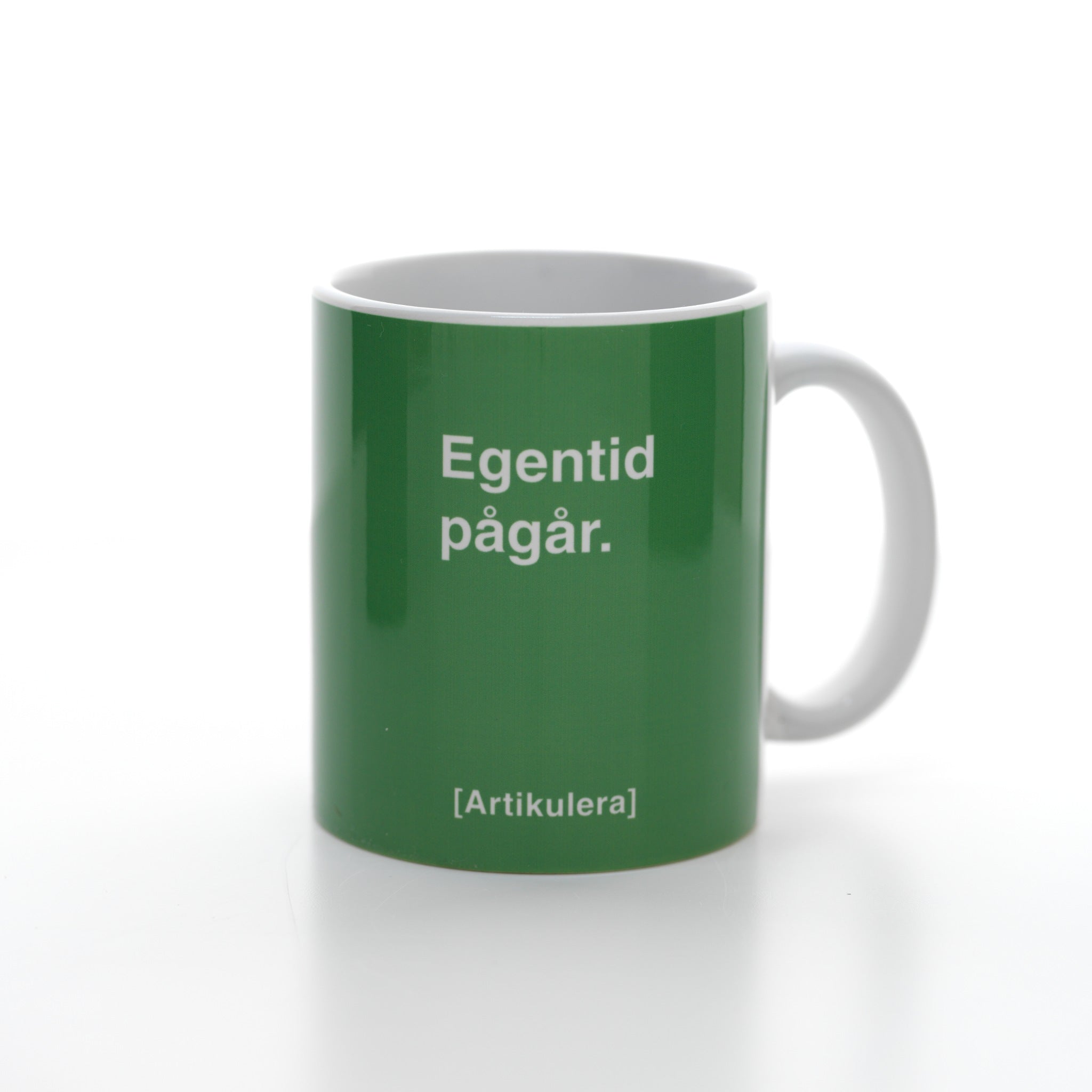 Artikulera-mugg — ”Egentid pågår.”