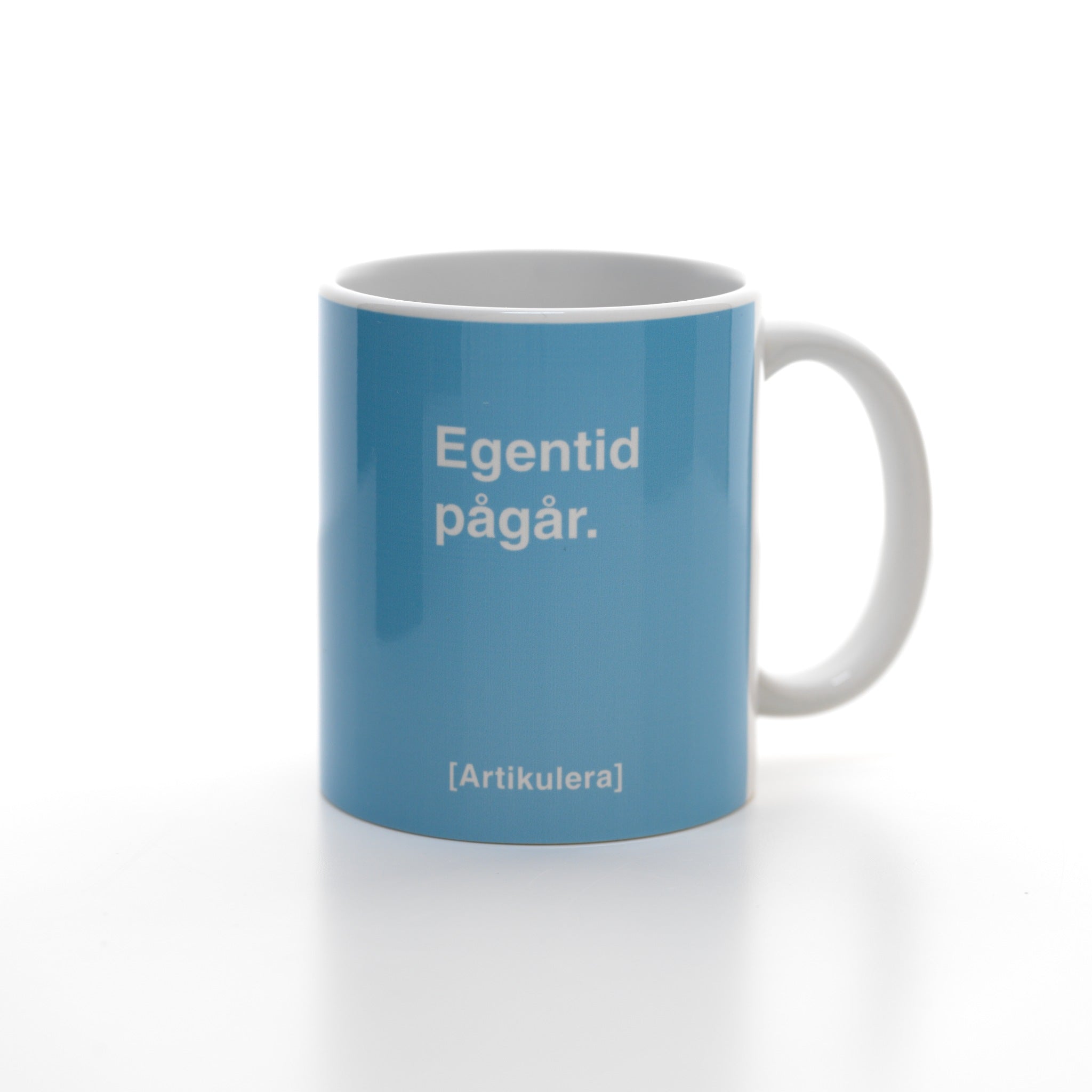 Artikulera-mugg — ”Egentid pågår.”
