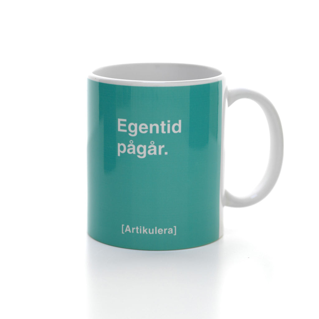 Artikulera-mugg — ”Egentid pågår.”