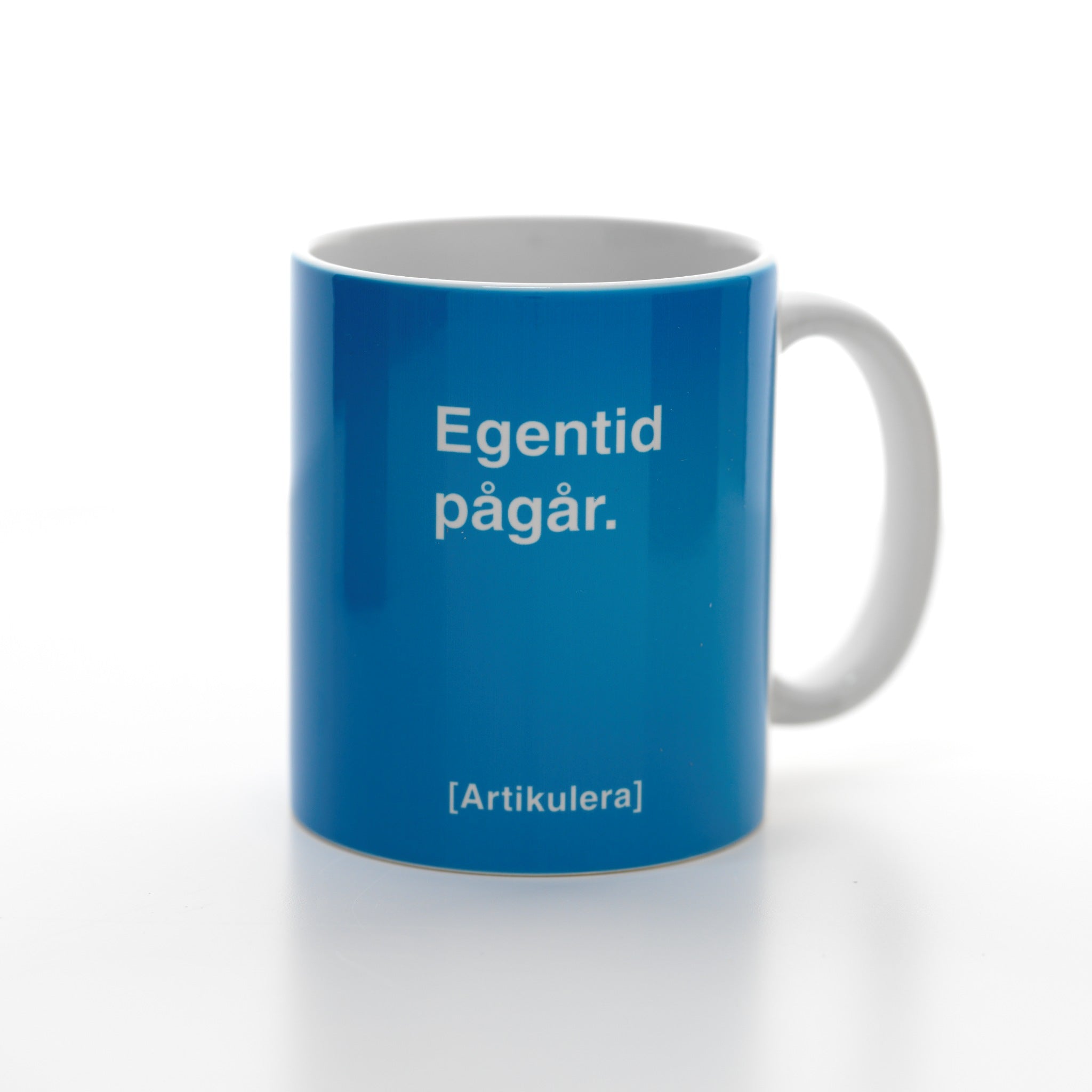 Artikulera-mugg — ”Egentid pågår.”